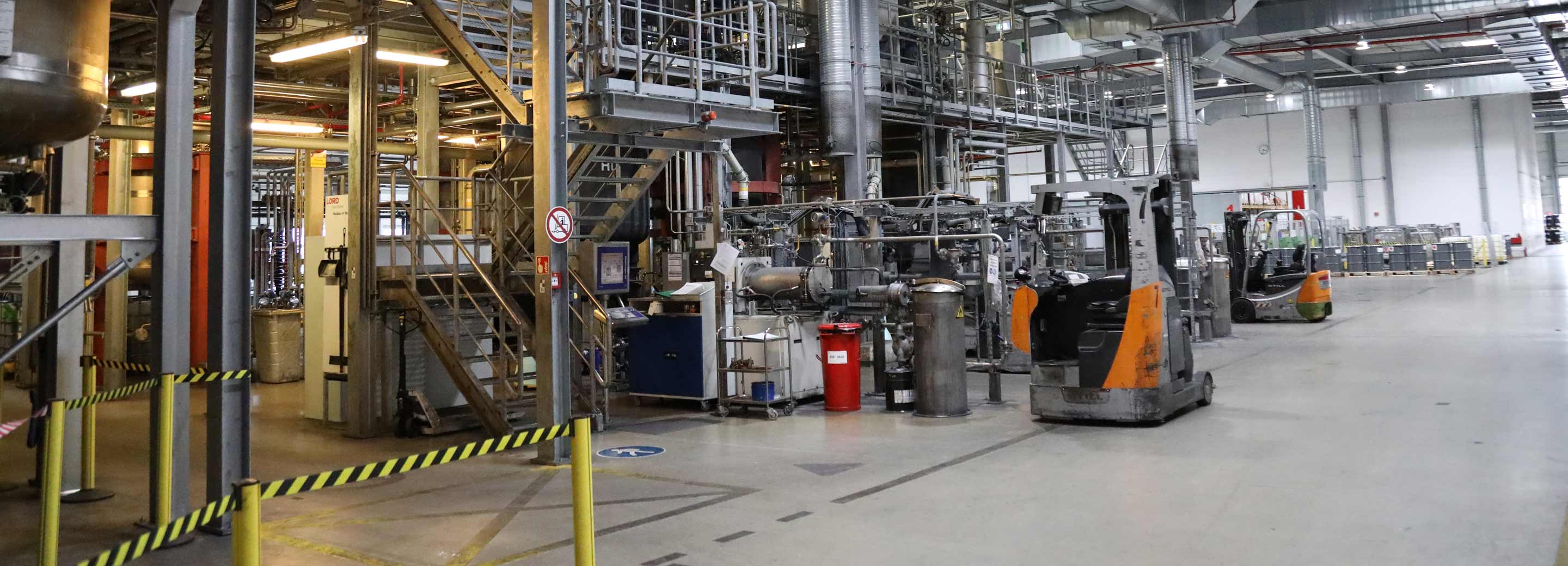 forklift driver working on high quality materials in warehouse