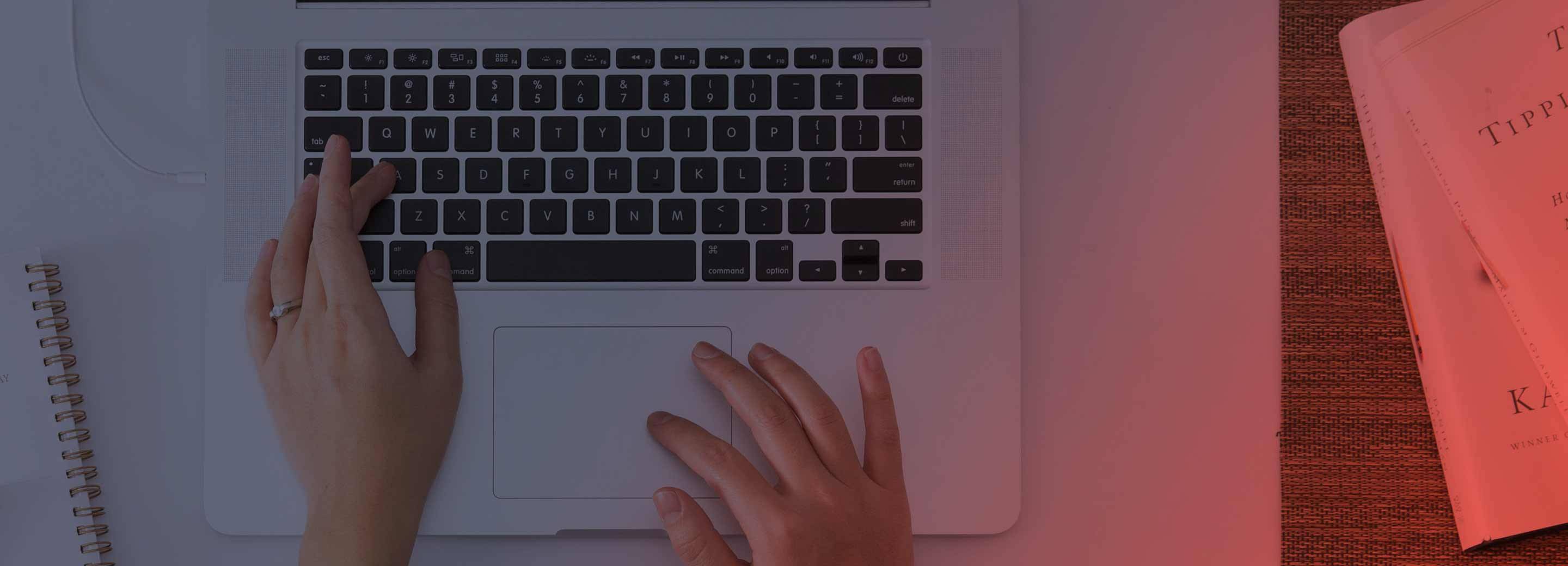 person typing and learning on laptop