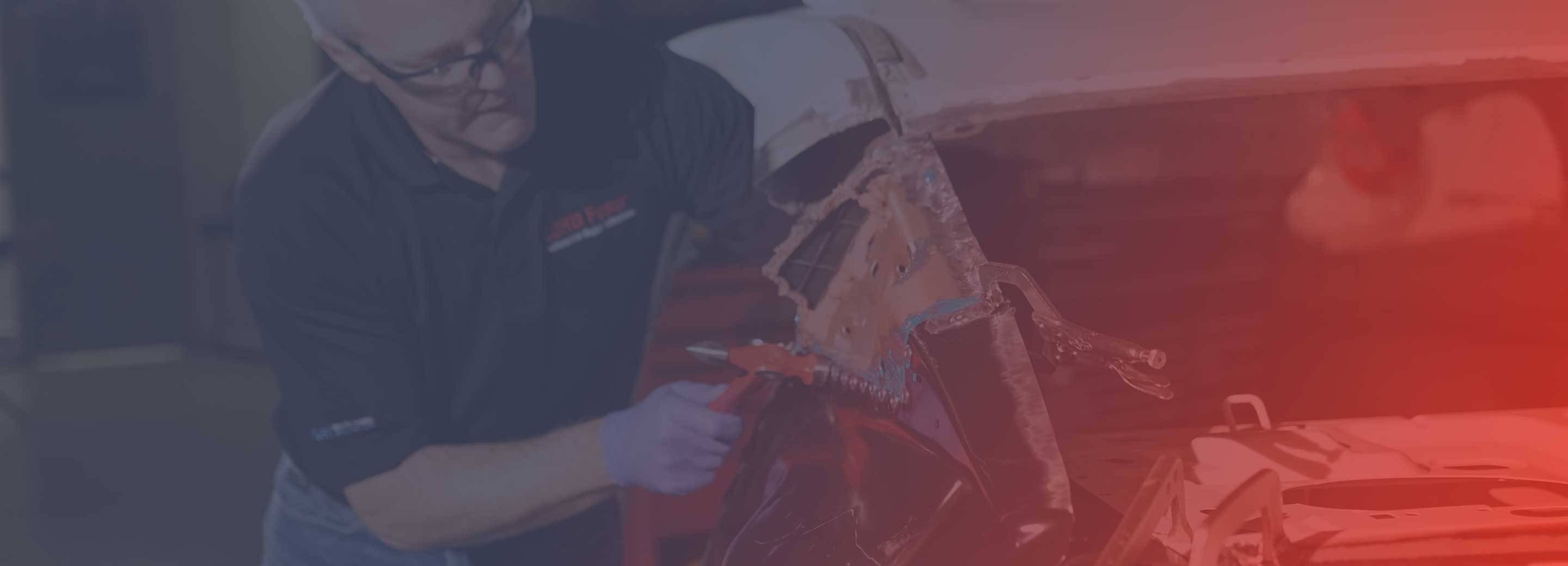 car technician working on vehicle repair